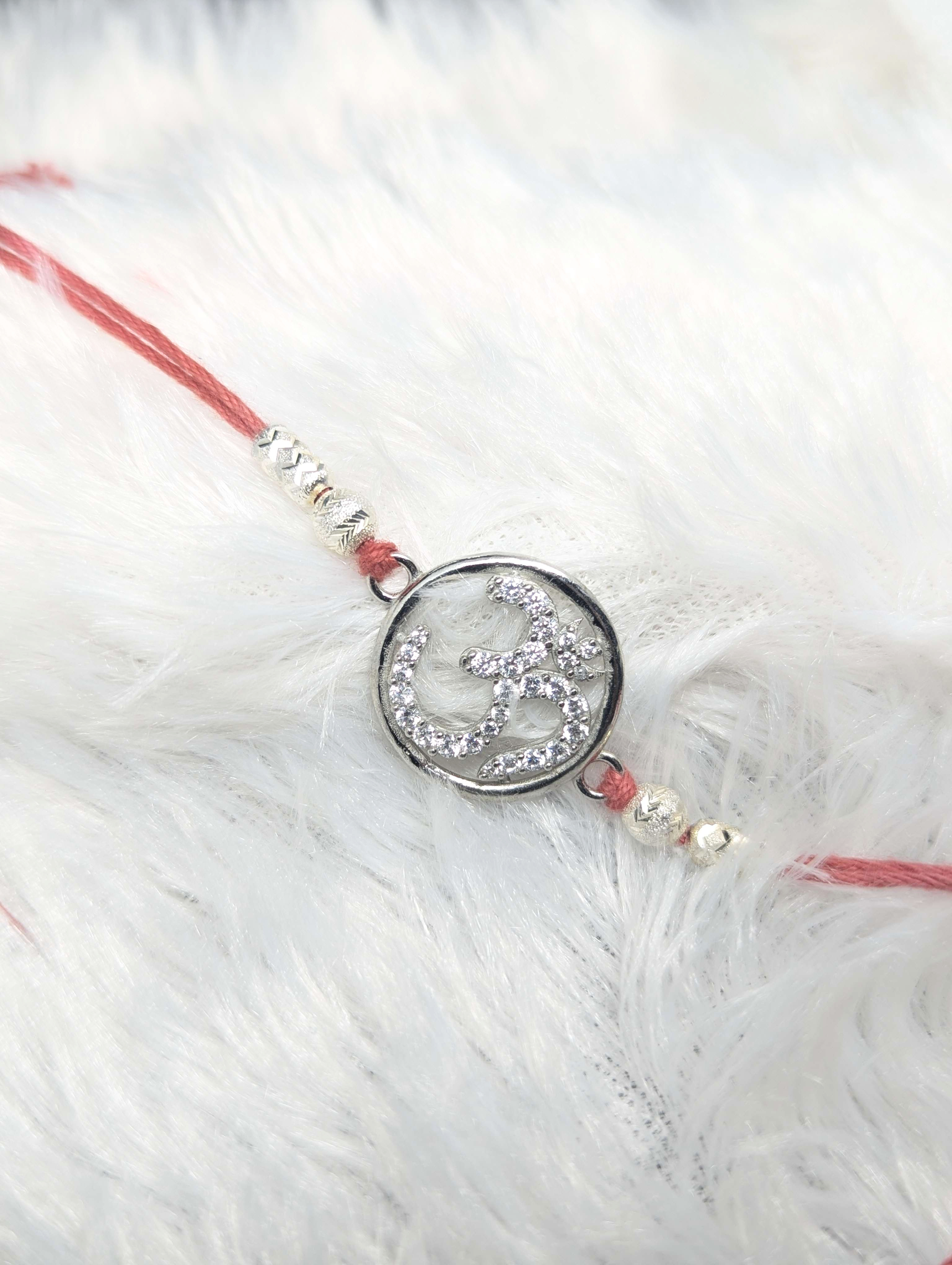 Radiant Om Sterling Silver Rakhi