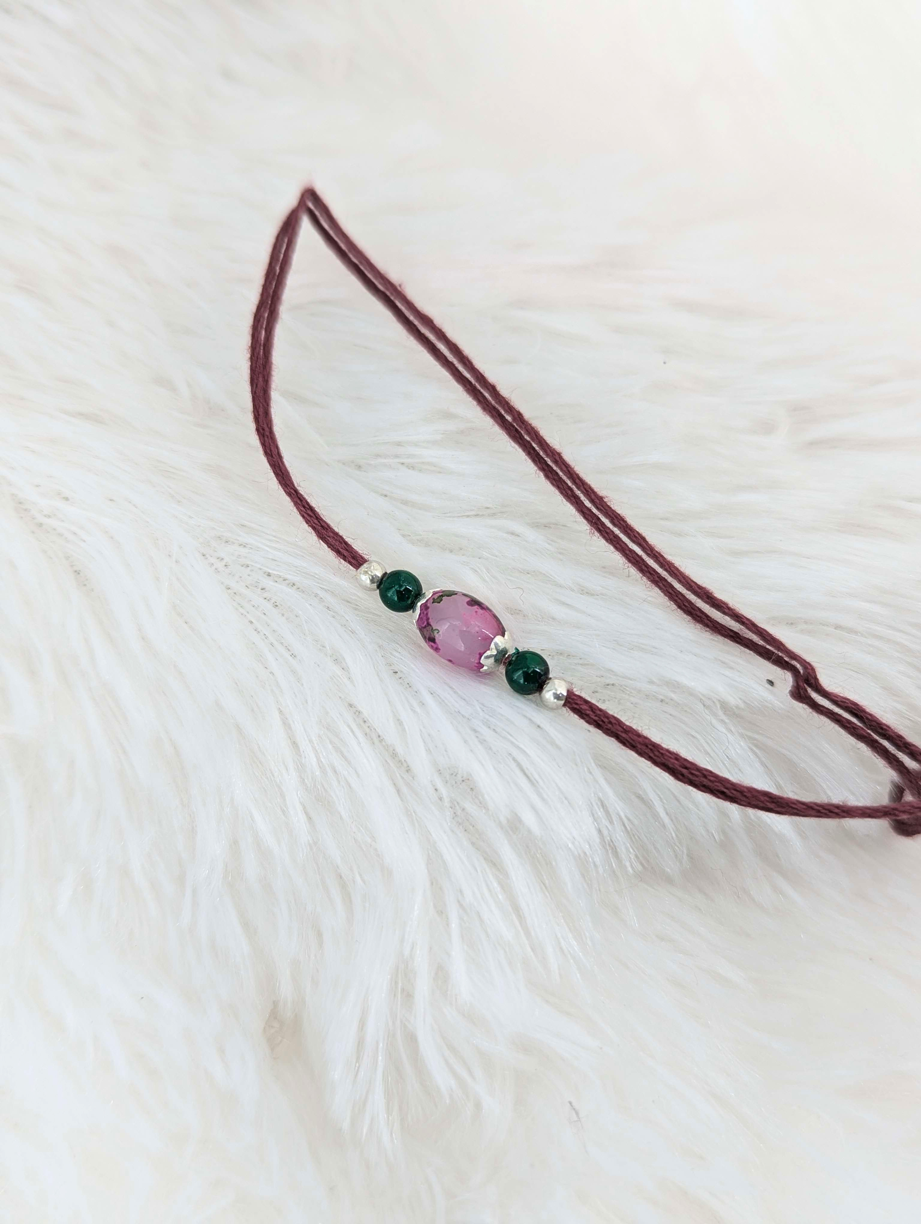 Enchanting Pink Stone & Emerald Bead Rakhi