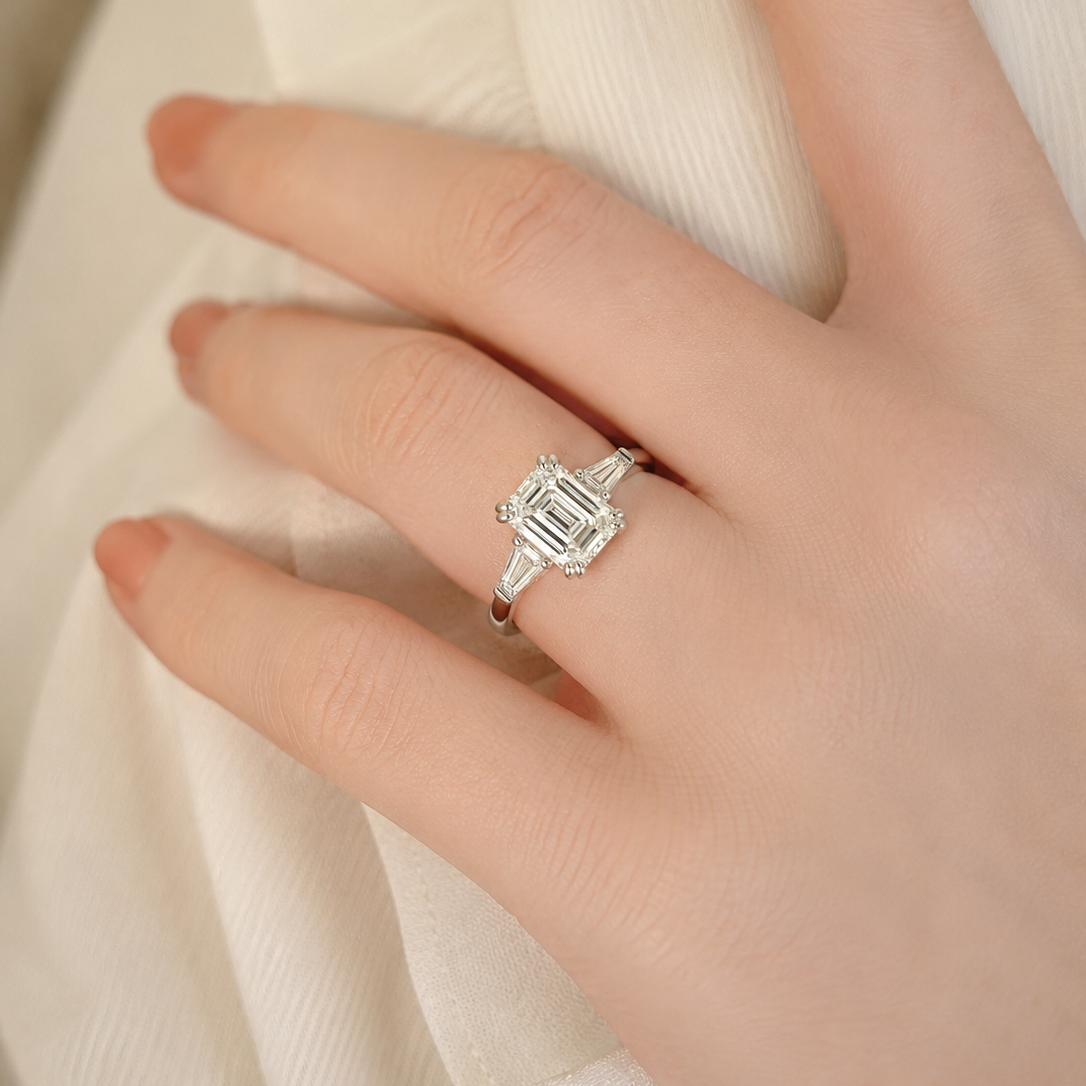 Sophisticated Emerald-Cut Three-Stone Engagement Ring