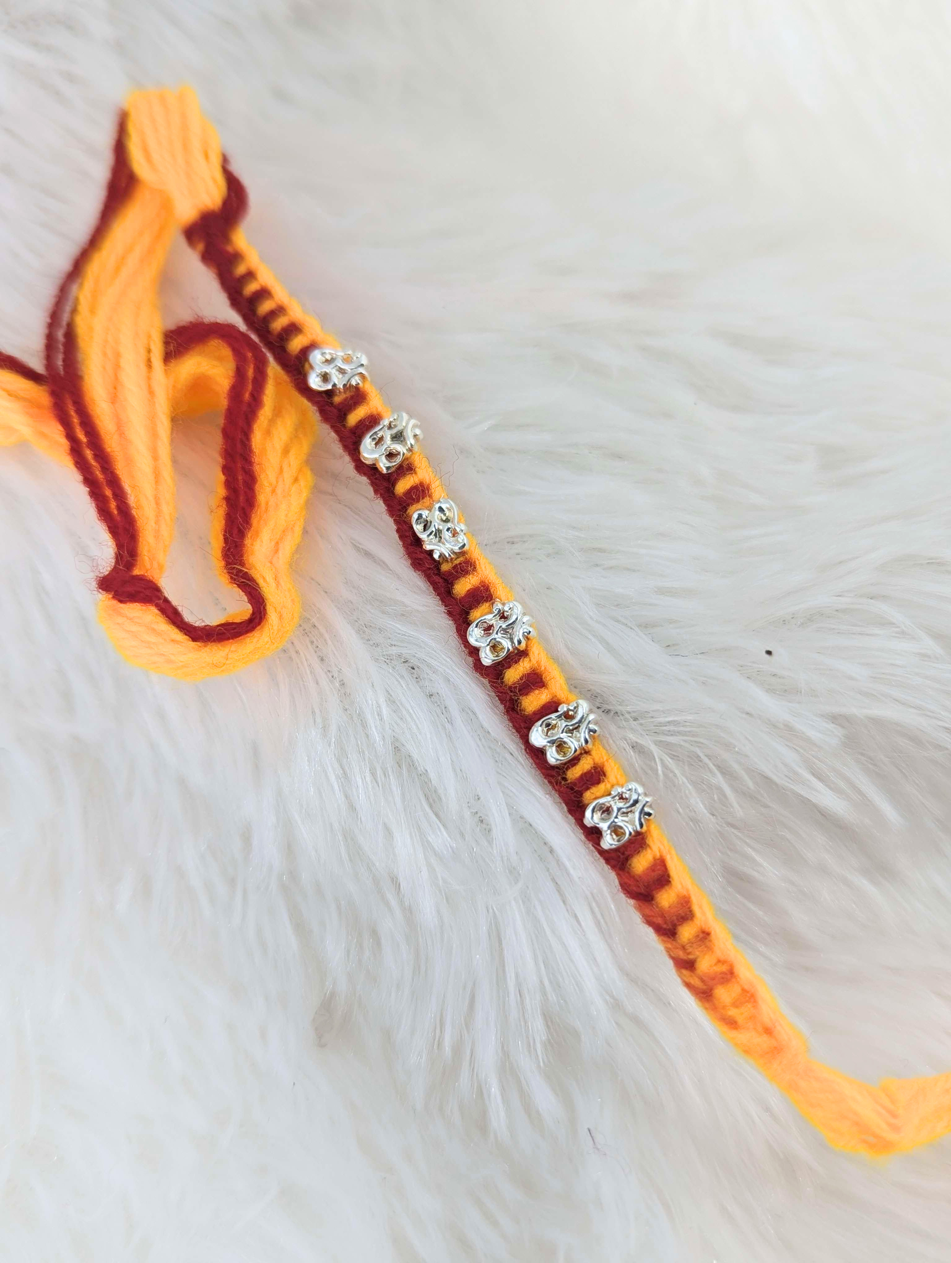 Vibrant Om Sterling Silver Rakhi