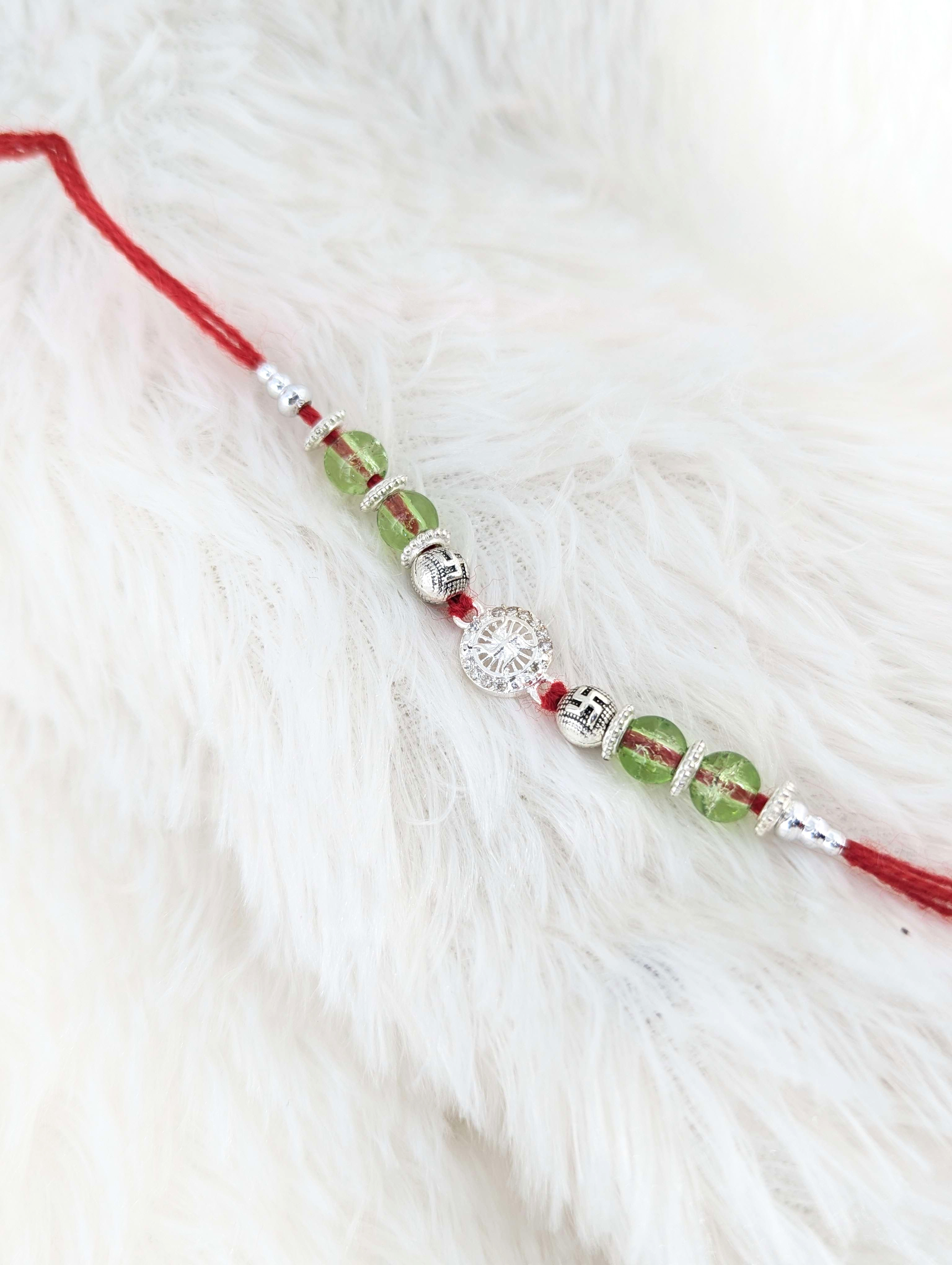 Divine Swastika & Green Bead Sterling Silver Rakhi