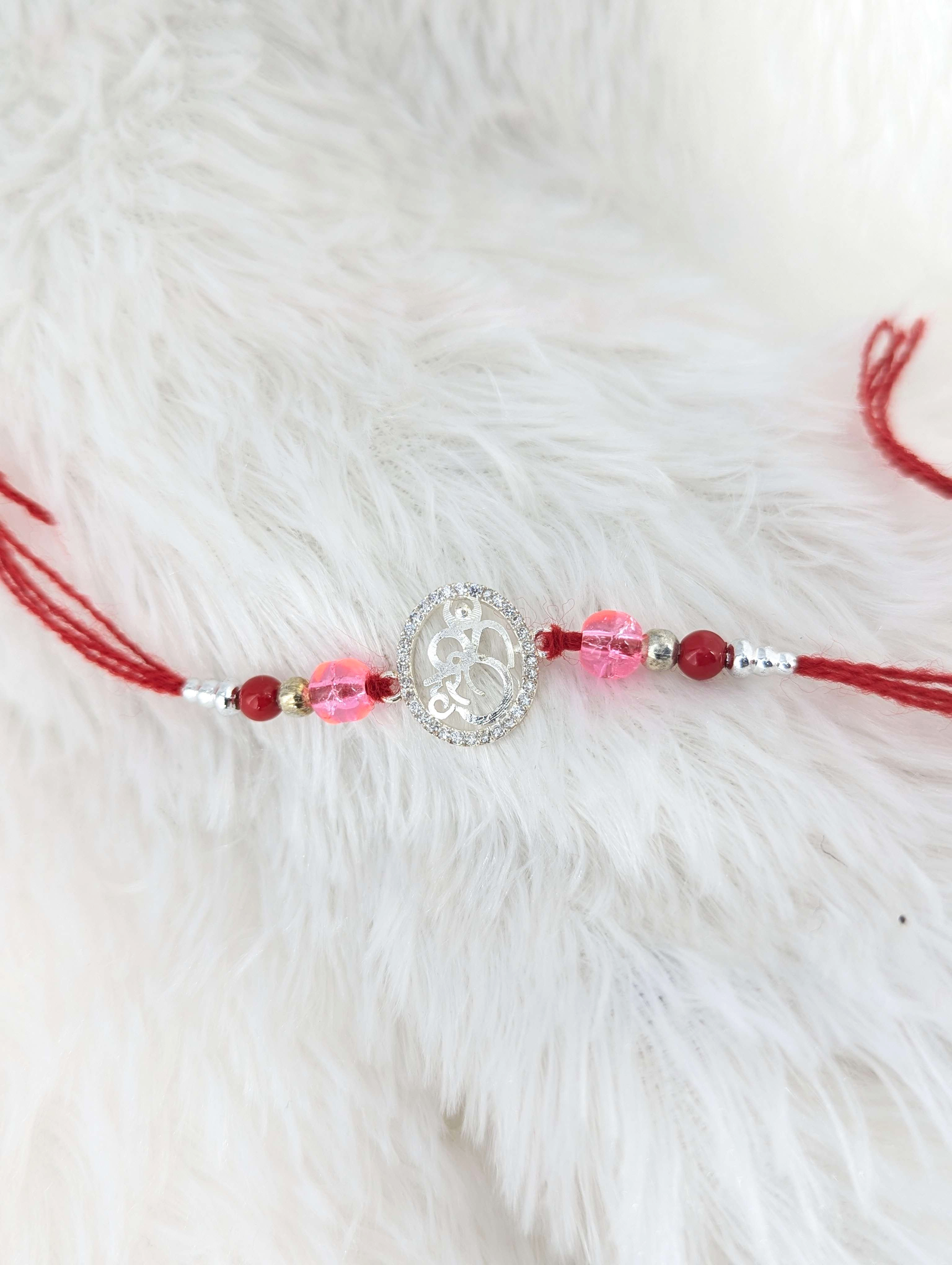 Radiant Om Sterling Silver Rakhi