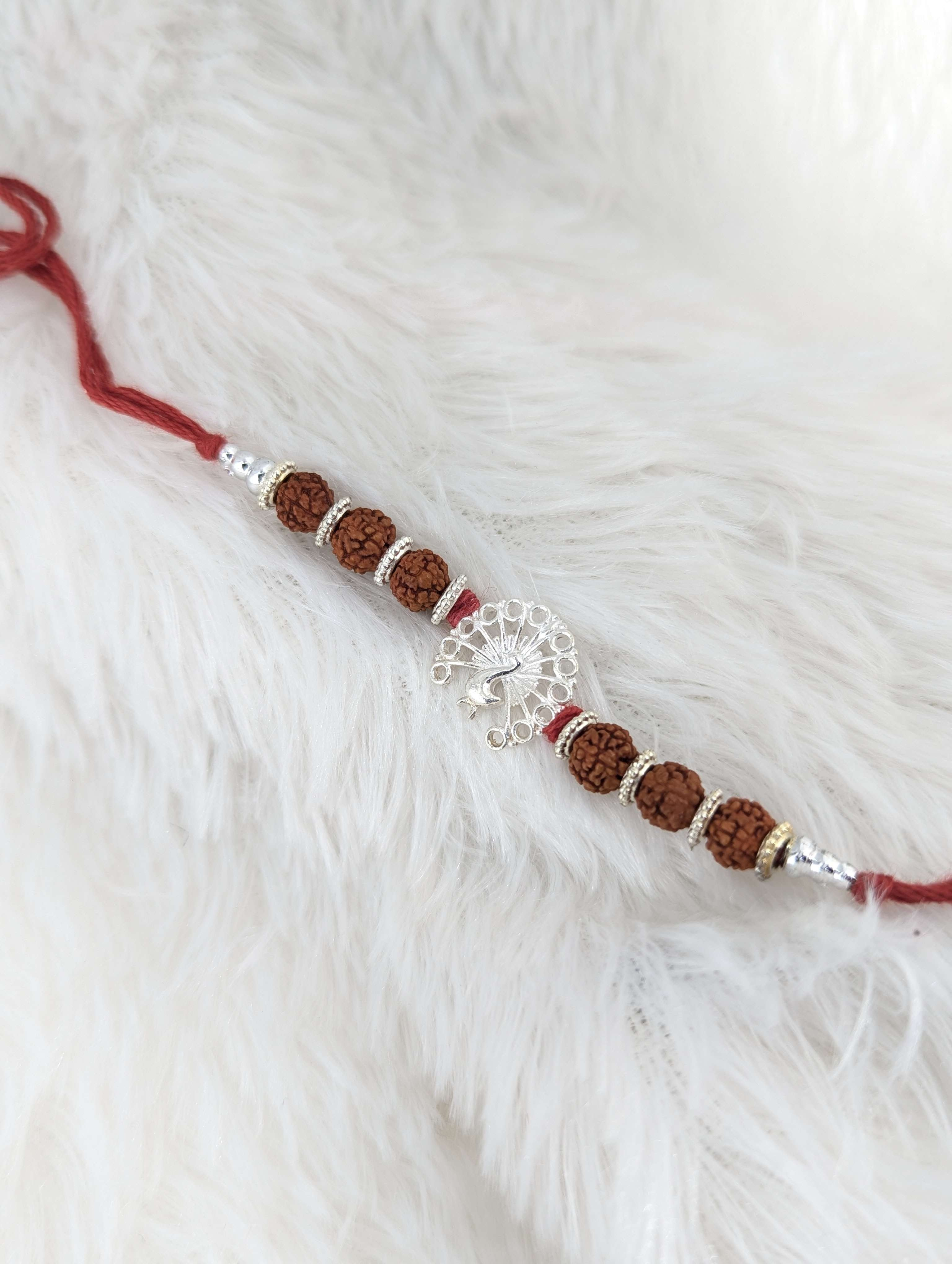 Graceful Peacock Rudraksha Sterling Silver Rakhi