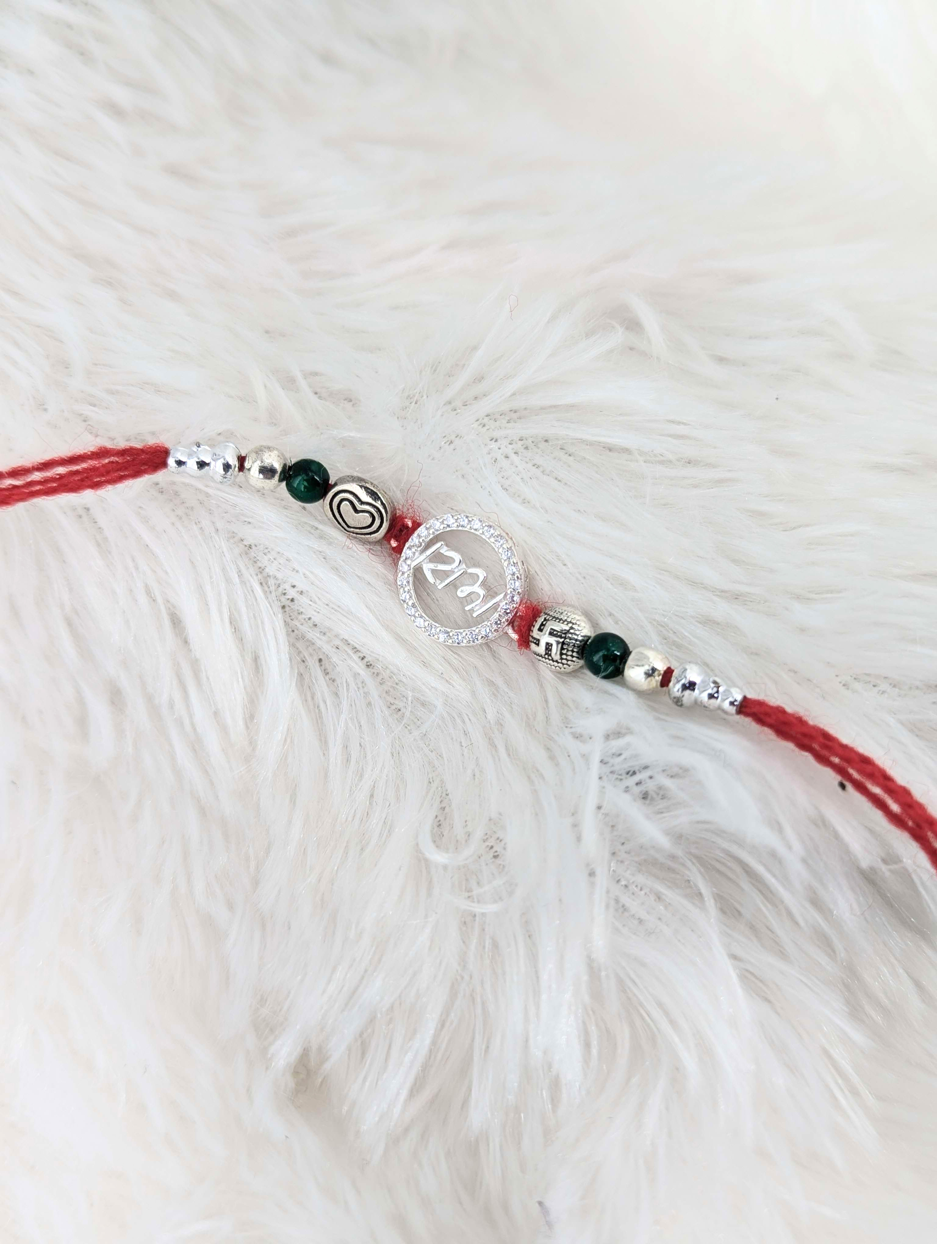 Auspicious "Bhai" Heart & Swastika Sterling Silver Rakhi