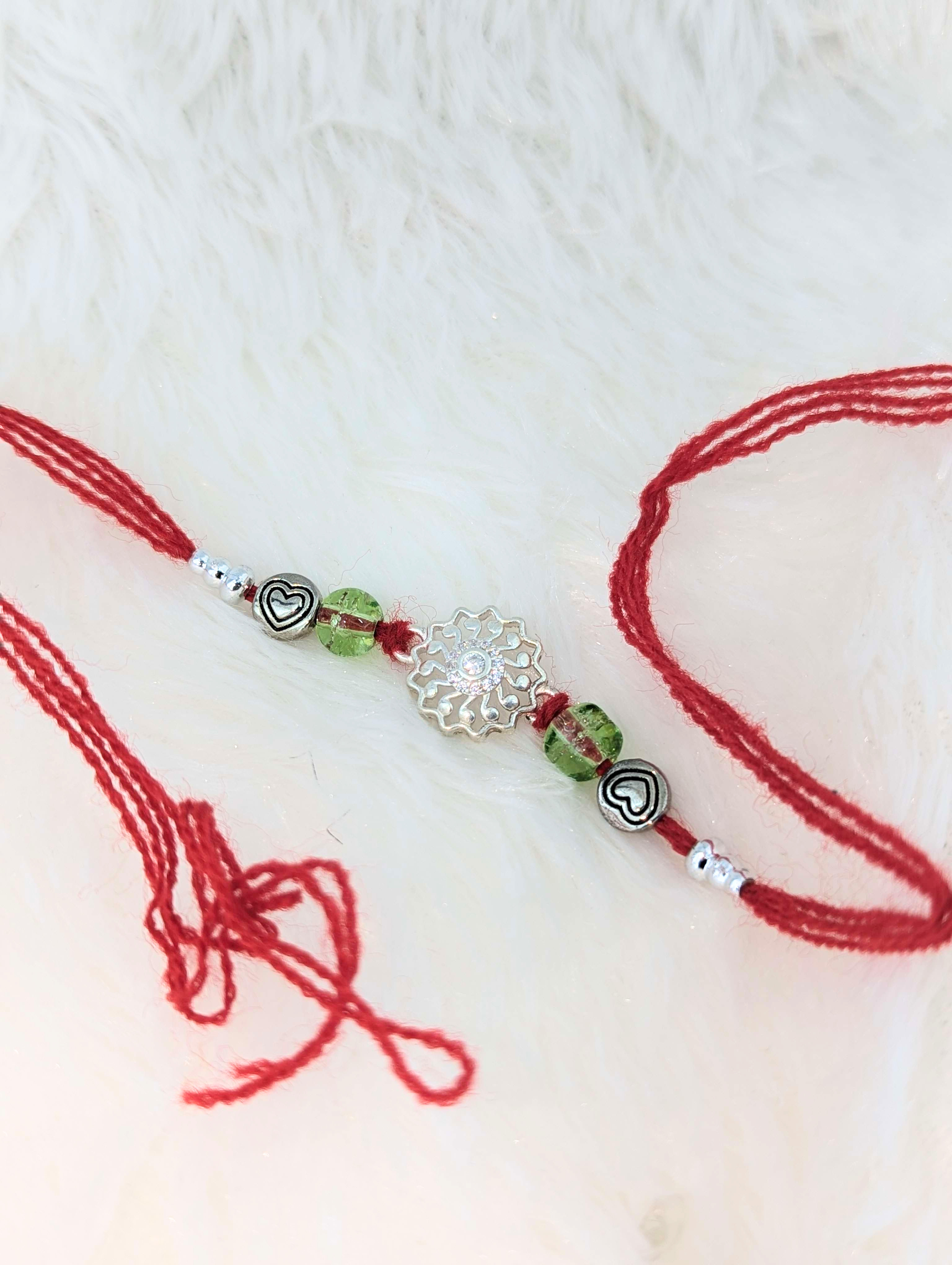 Radiant Heart & Floral Sterling Silver Rakhi