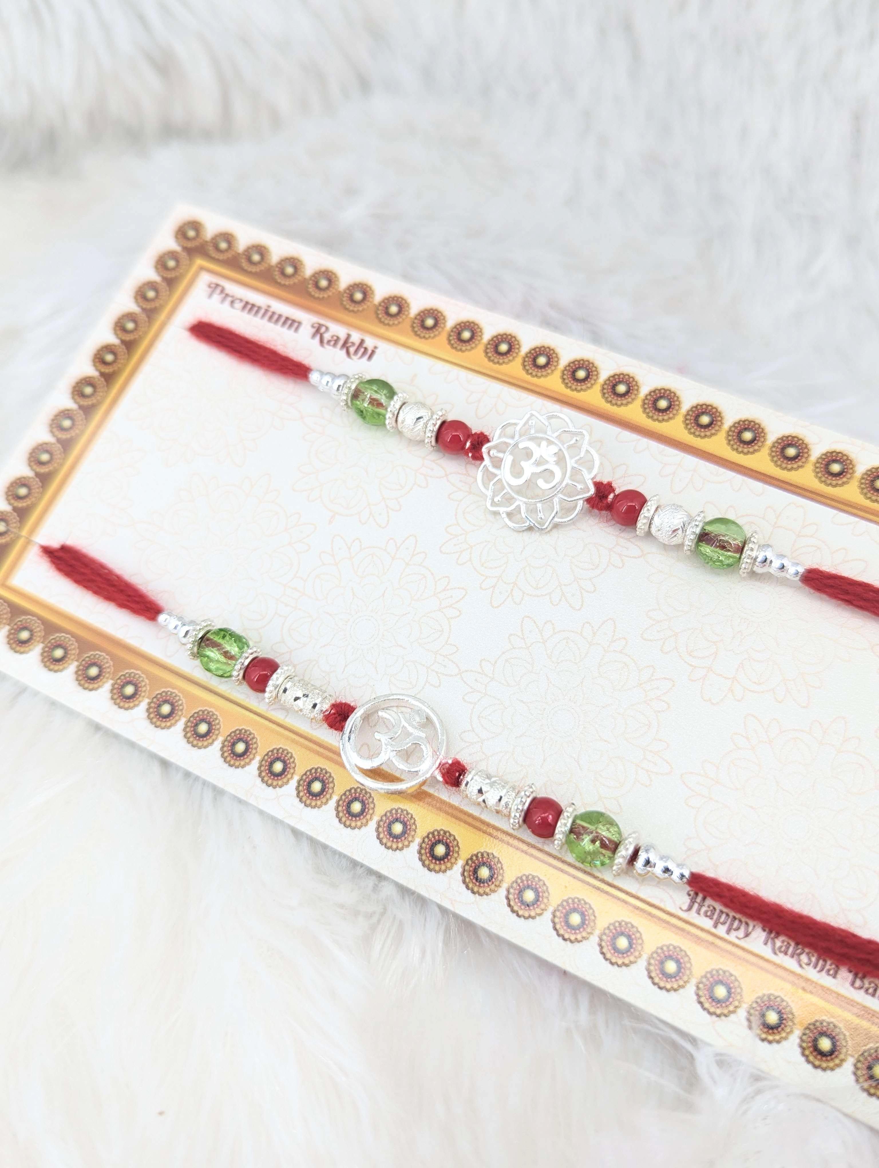 Divine Om Sterling Silver Rakhi Duo Set