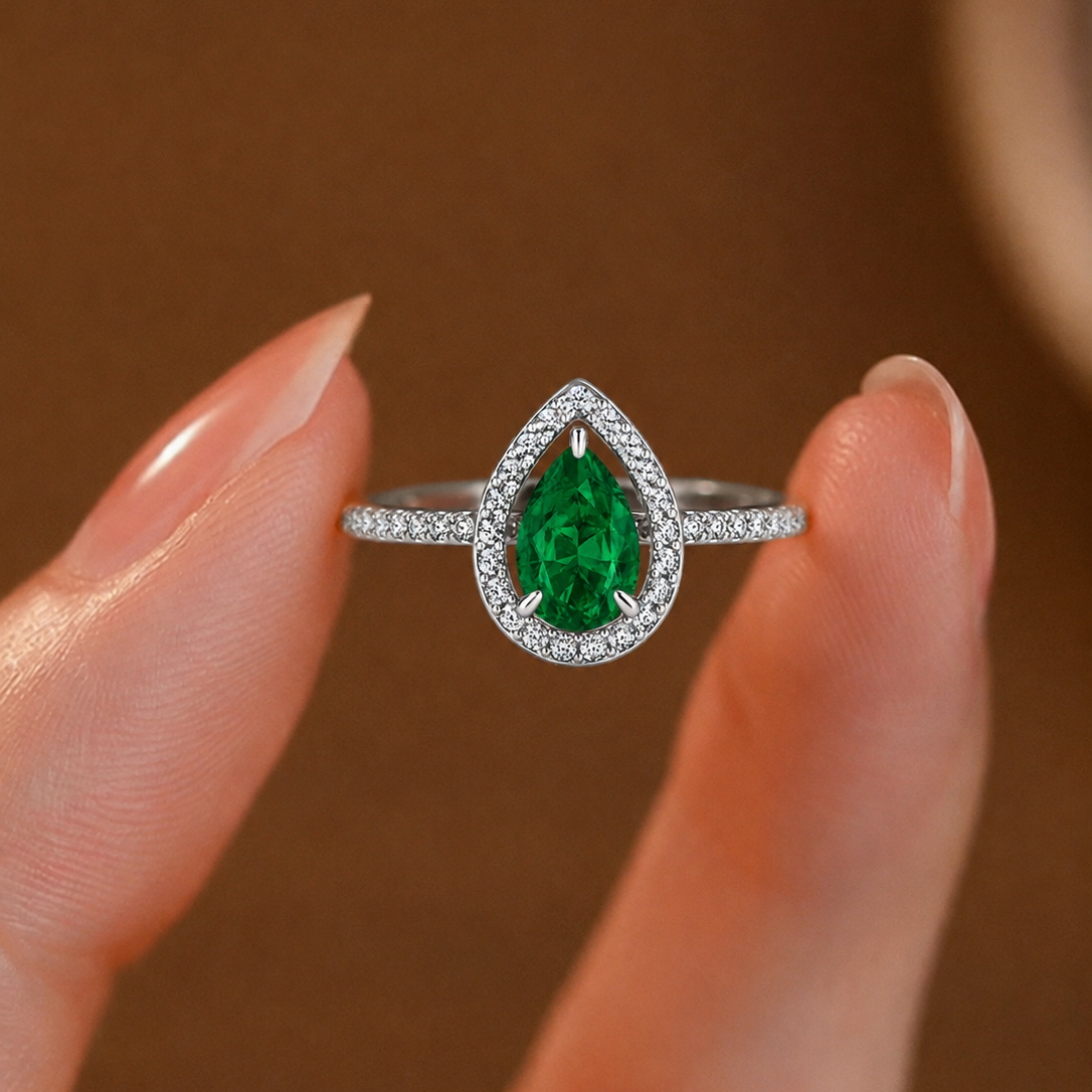 Regal Pear-Cut Emerald Halo Cluster Ring