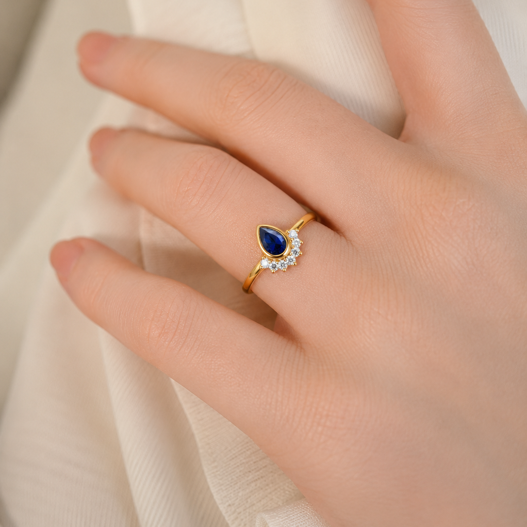 Regal Pear-Cut Sapphire and Diamond Halo Cluster Ring